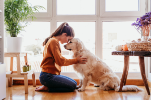 a woman hugging her dog