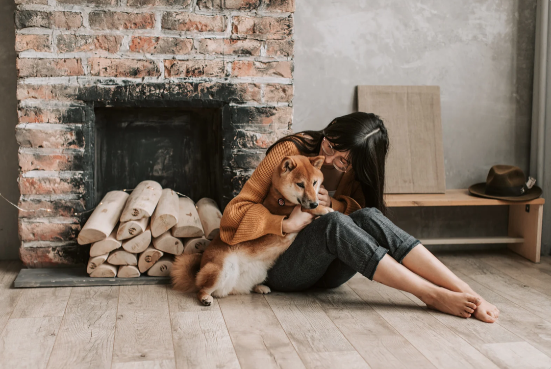 woman hugging her senior dog