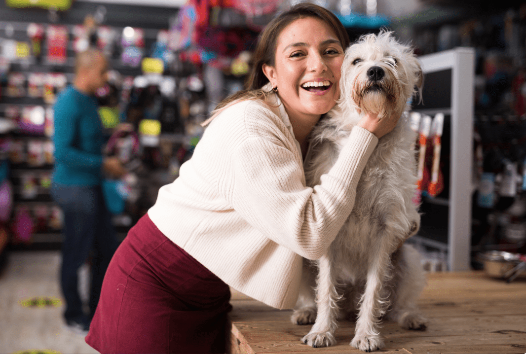 a girl hugging her foster dog